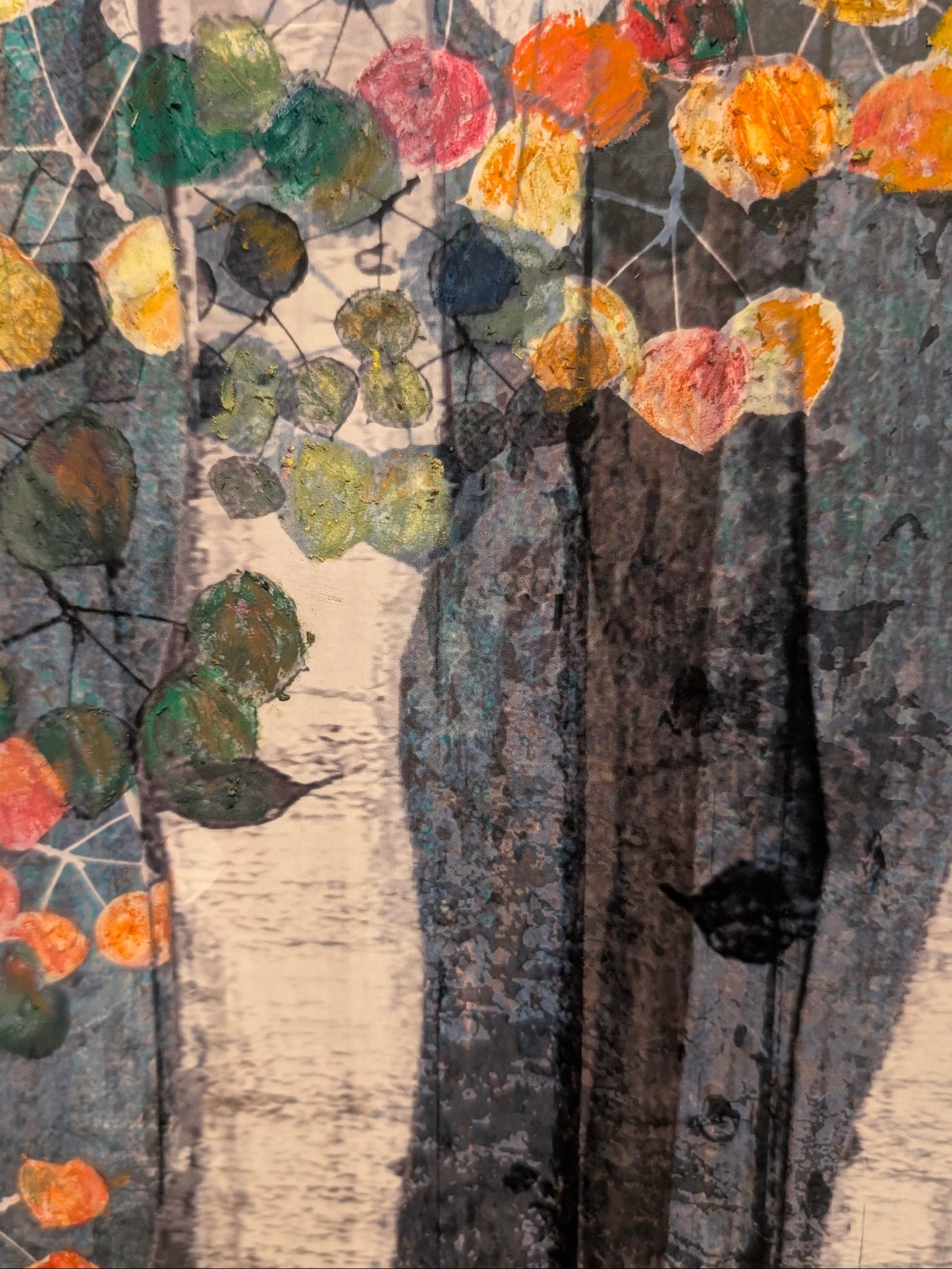 Artistic depiction of trees with colorful leaves on a textured background